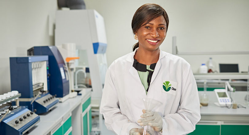 A female cocoa employee in an innovation laboratory, Olam.